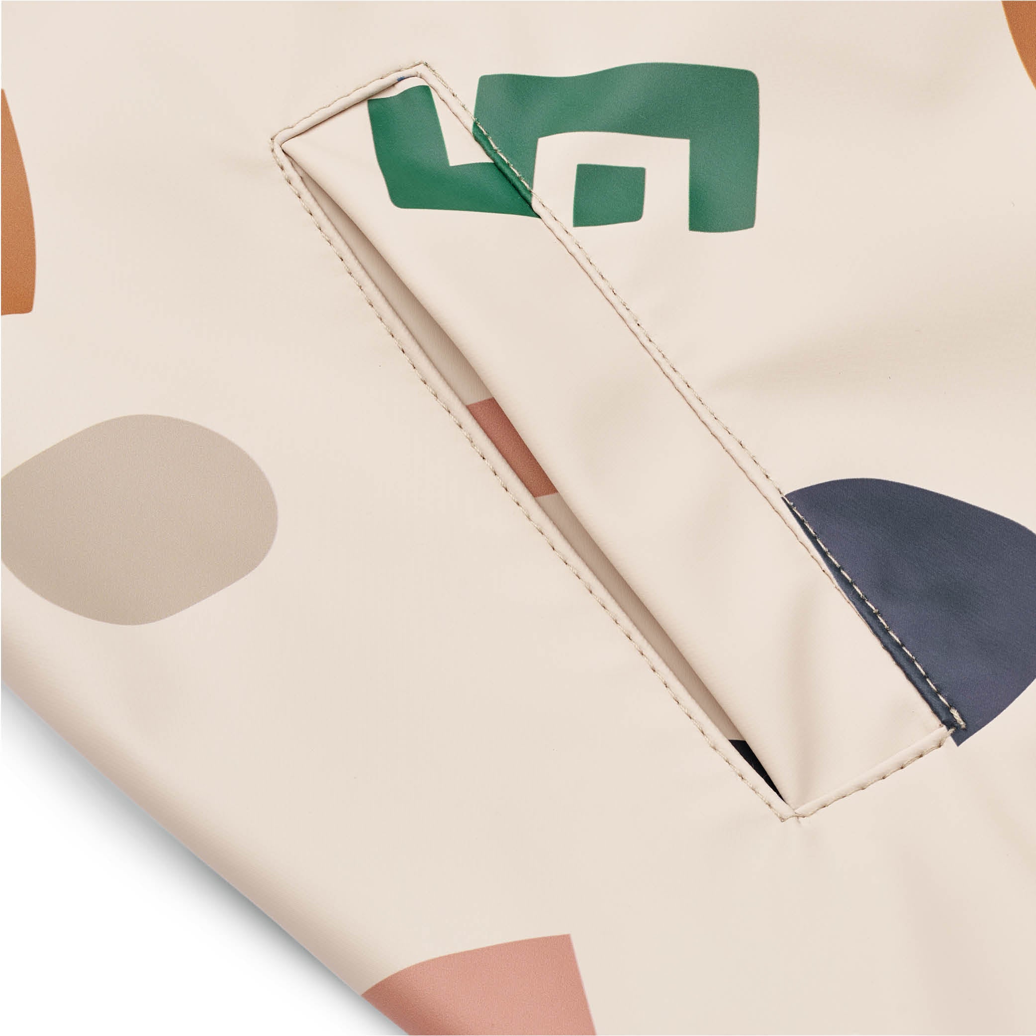 Regenjacke und -hose Melodi in graphic alphabet/sandy