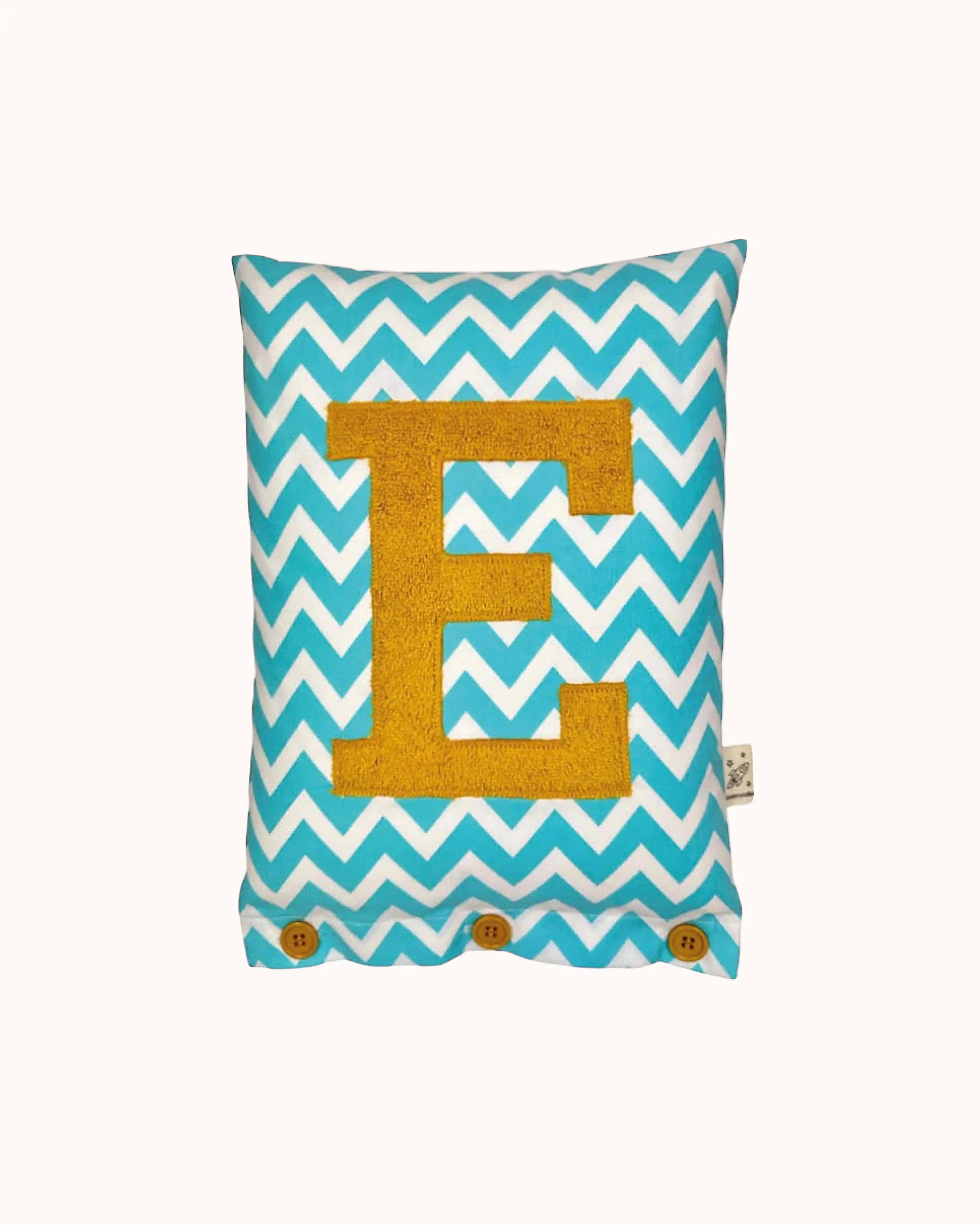 Letter Cushion Turmeric on White with turquoise Zigzag