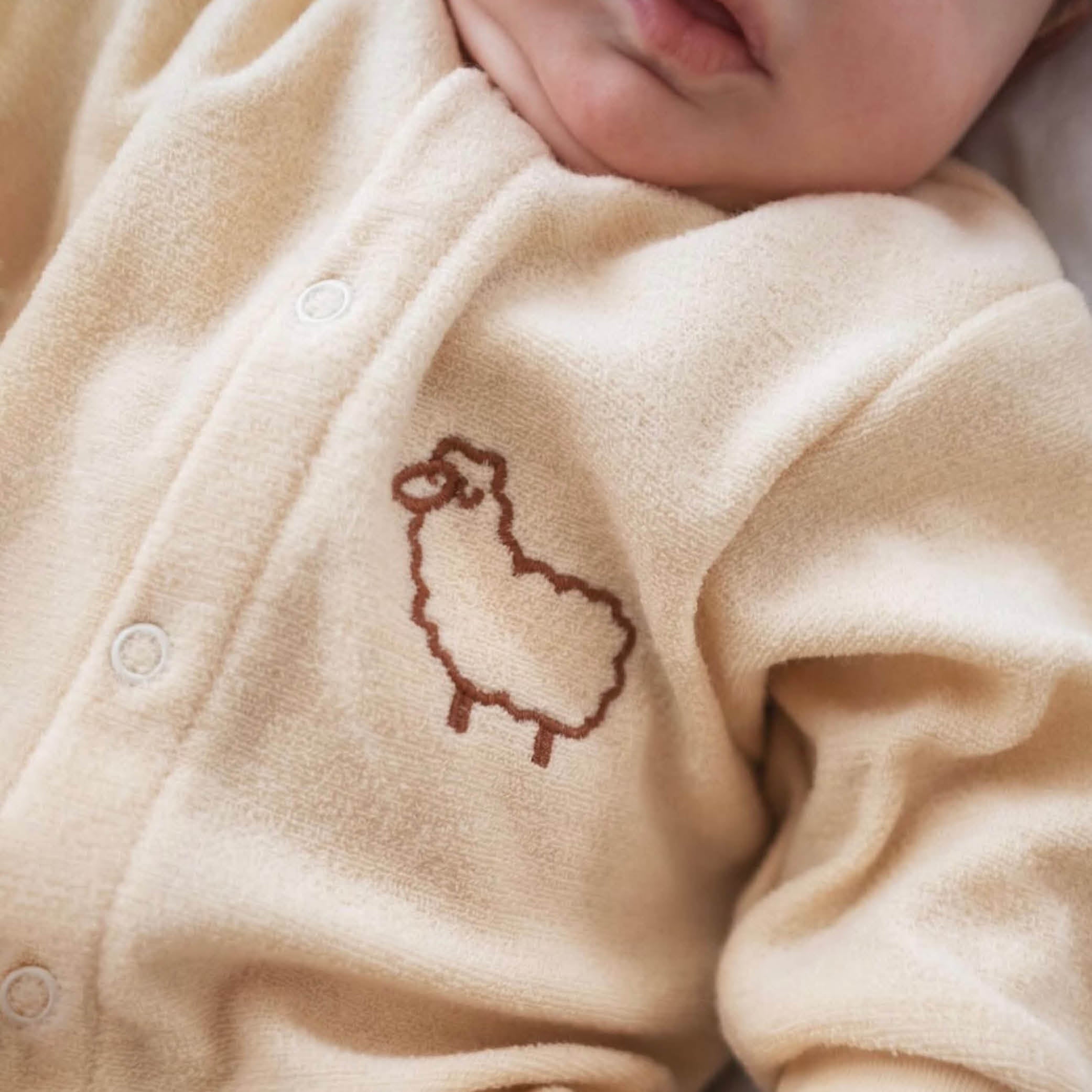Baby Onesie aus Wolle in natur