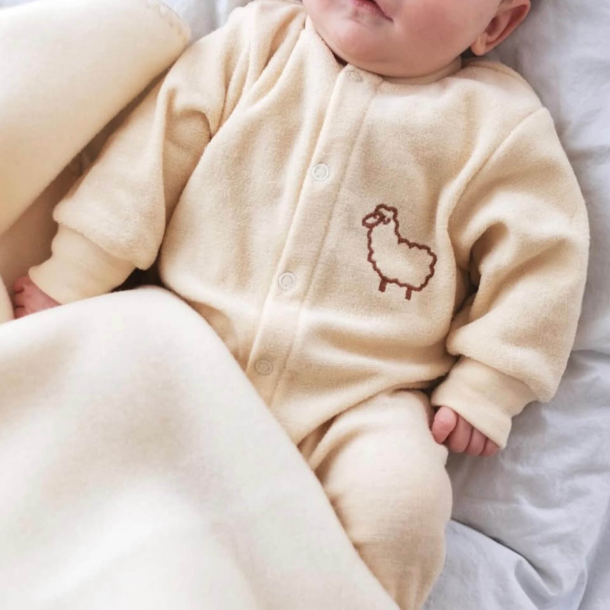 Baby Onesie aus Wolle in natur