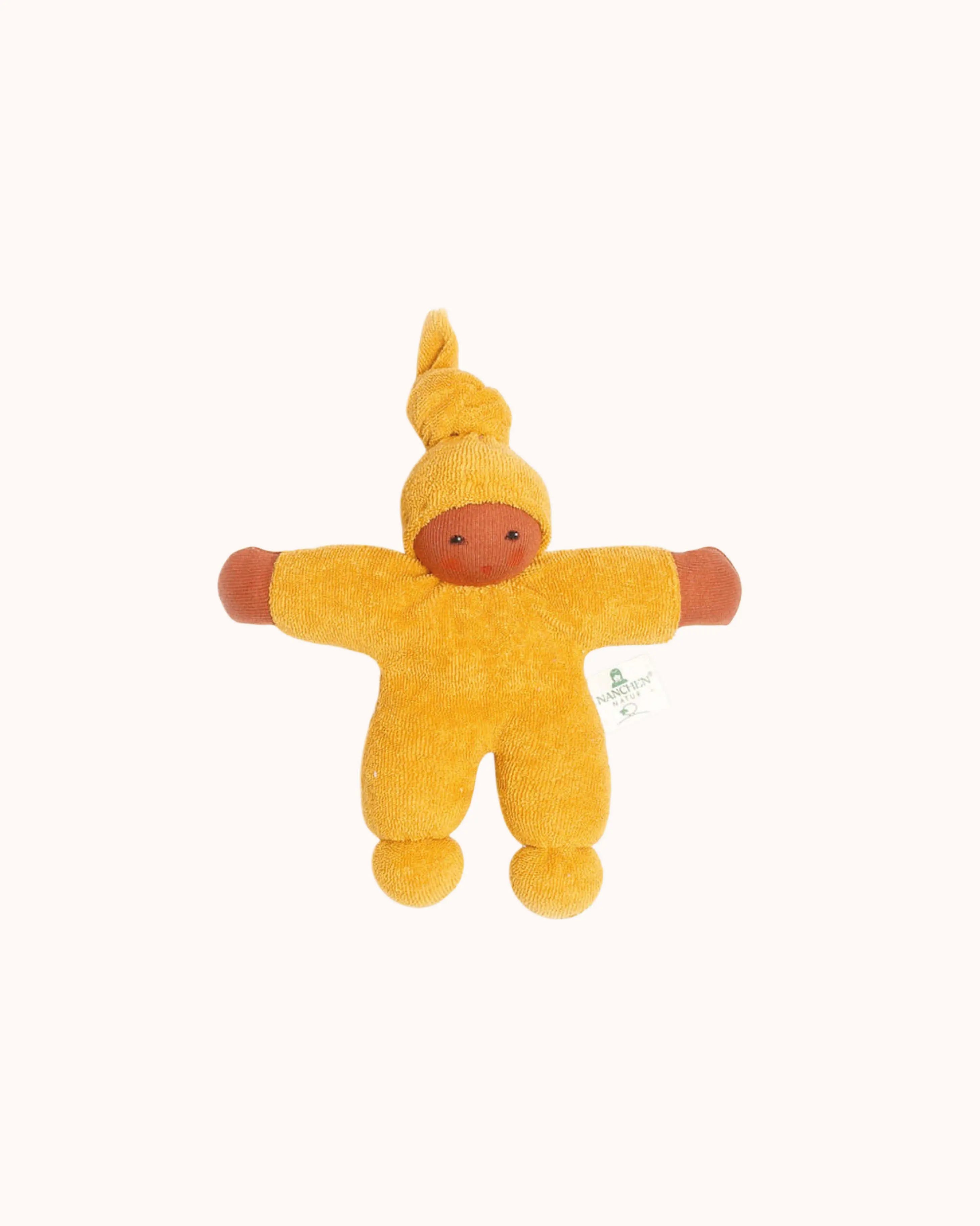 Stoffpuppe in goldgelb