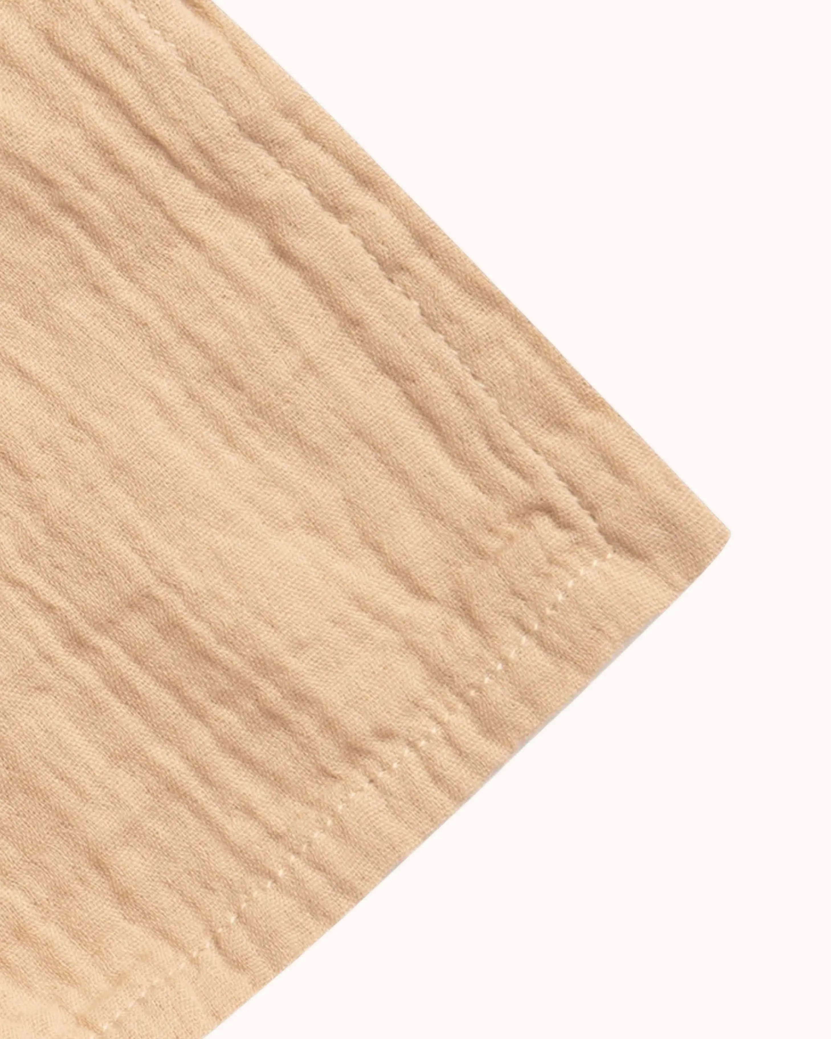 Muslin Swaddle Blanket in hay