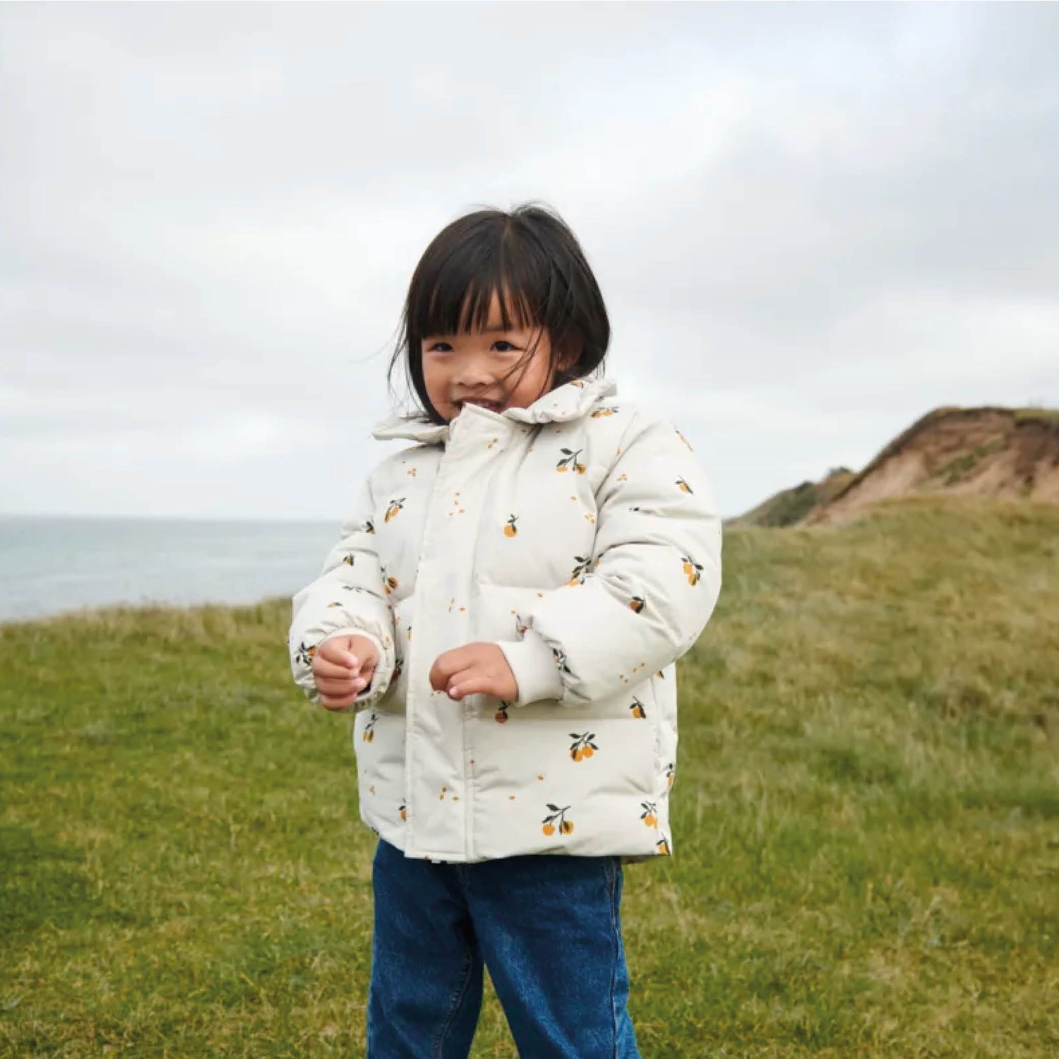 Anemone Down Puffer Jacket in peach/sandy